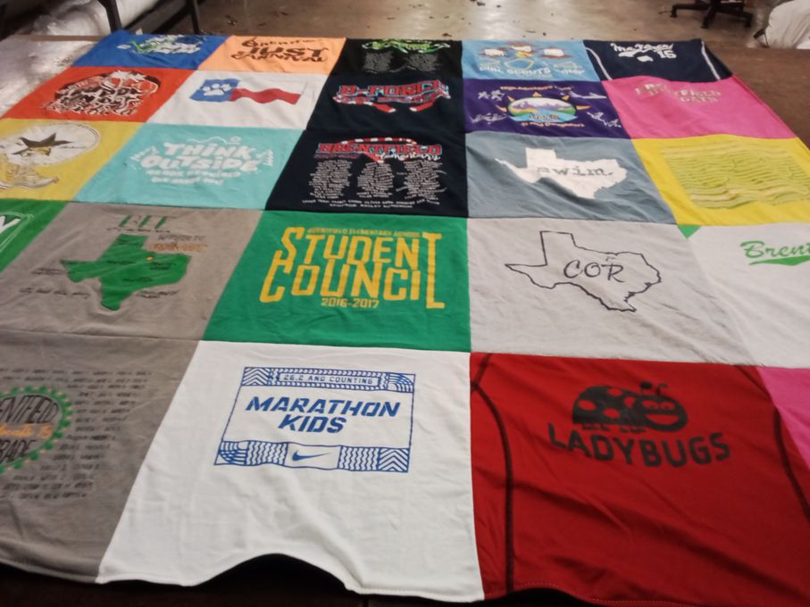 T-shirt quilt with education, outdoor activities themes by Audrey from TX