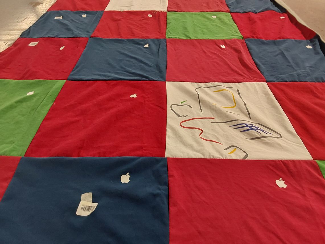 T-shirt quilt with technology themes by Natalie from TX