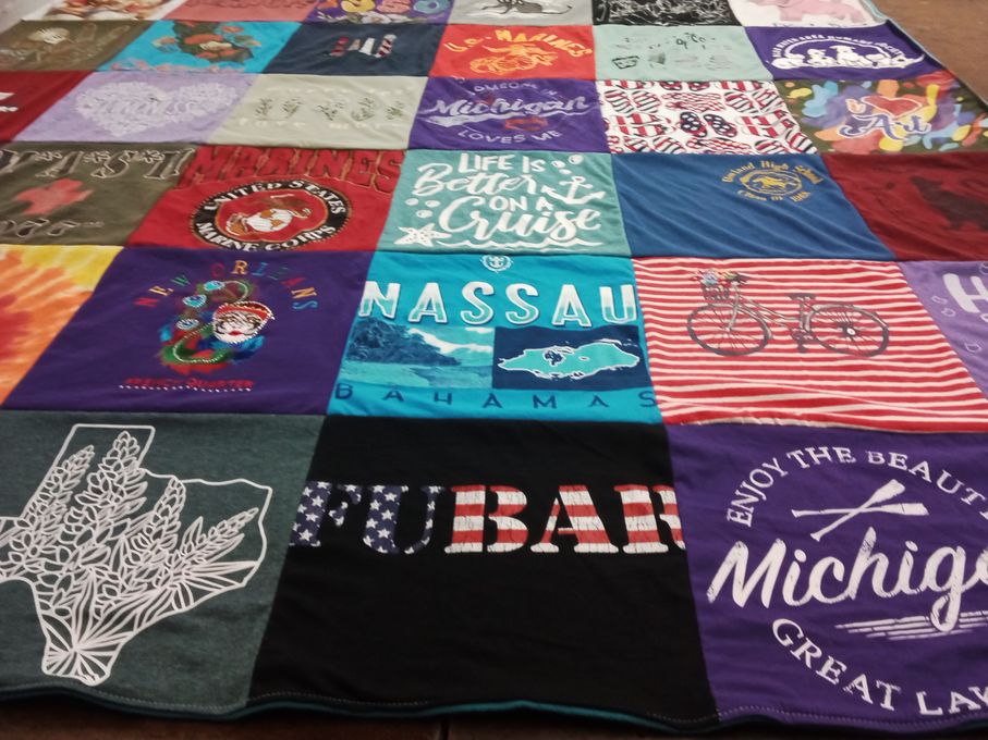 T-shirt quilt with travel, marine corps themes by Sharon L from MI