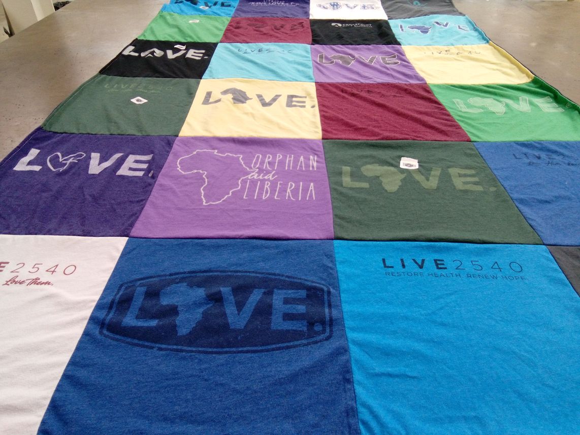 T-shirt quilt with support for orphans, charity work themes by Cathy from GA