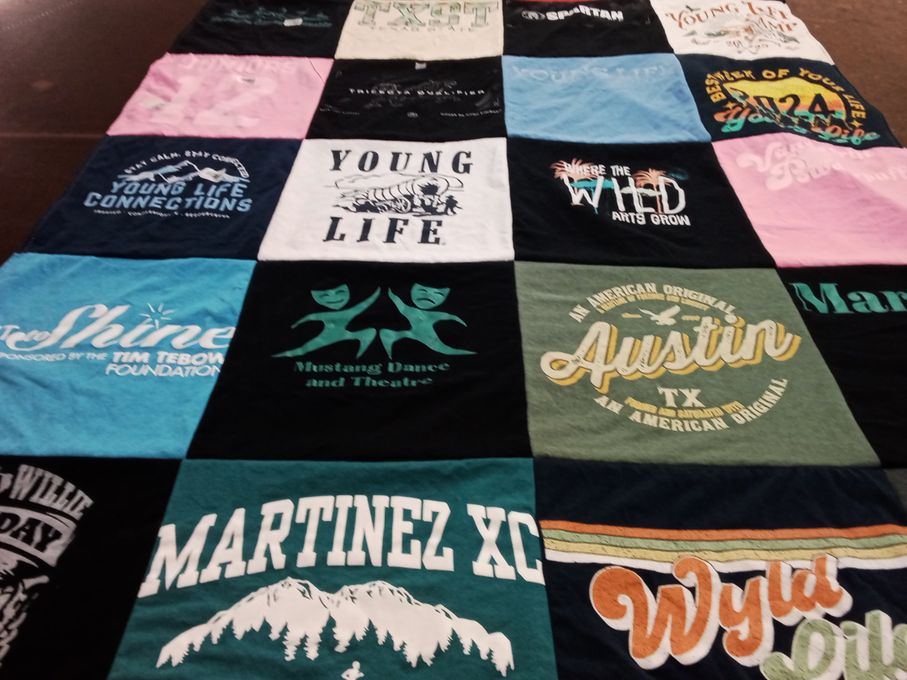 T-shirt quilt with dance, theatre themes by Praise from CO