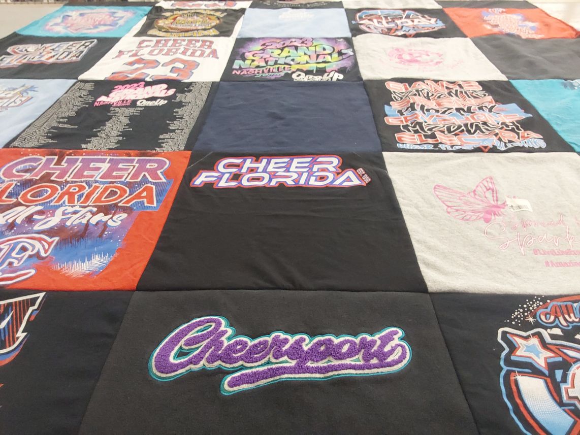 T-shirt quilt with cheerleading themes by Heather from FL