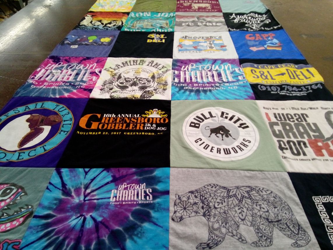 T-shirt quilt with food, sports themes by Parker from NC