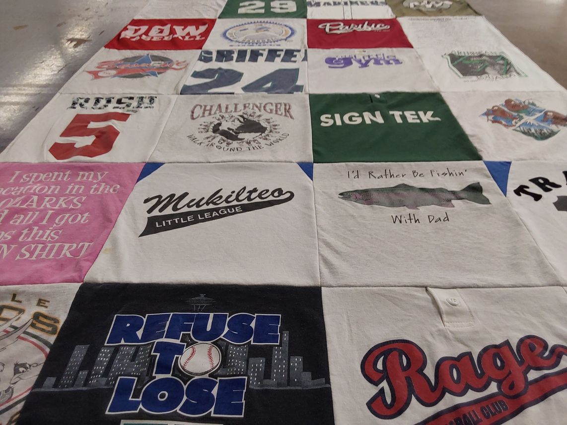 T-shirt quilt with sports, outdoor activities themes by Christie from TN