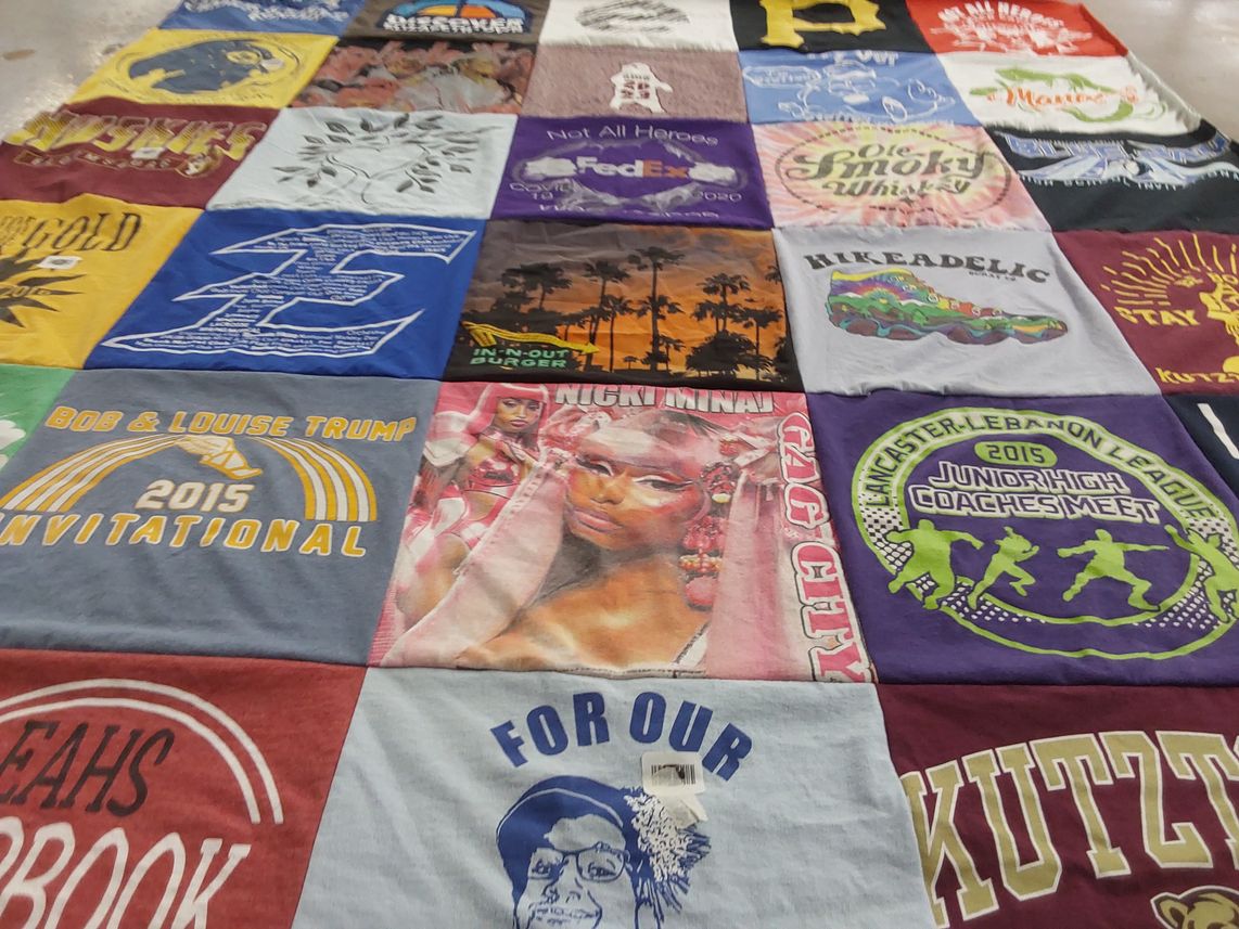 T-shirt quilt with sports, music themes by Lori from PA