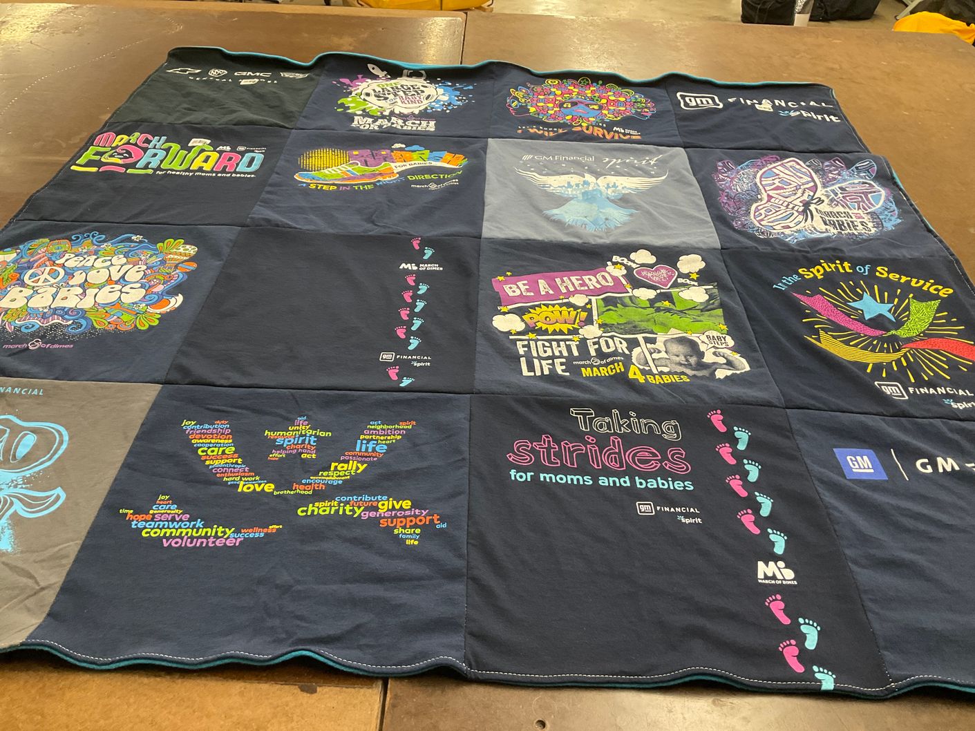 T-shirt quilt with charity, community service themes by Susan from TX