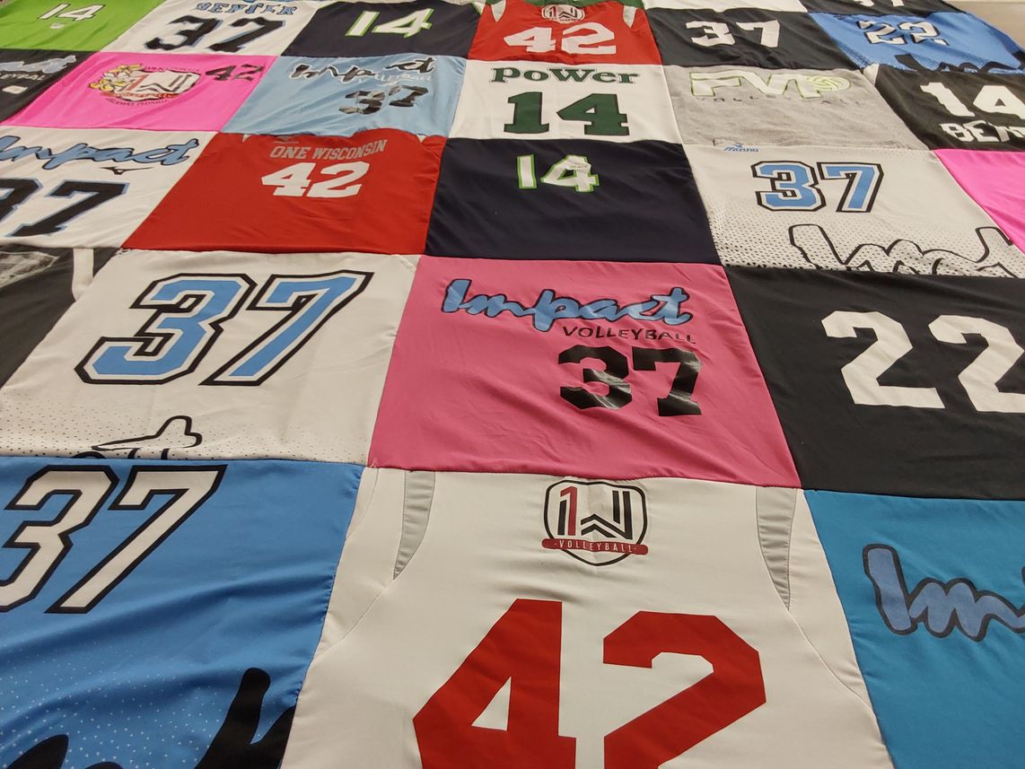T-shirt quilt with volleyball themes by Mickenzi from WI