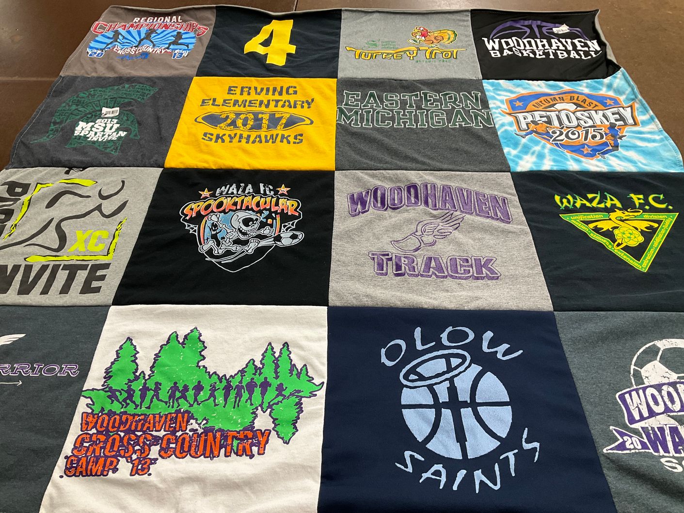 T-shirt quilt featuring woodhaven track, waza fc by Michelle from MI
