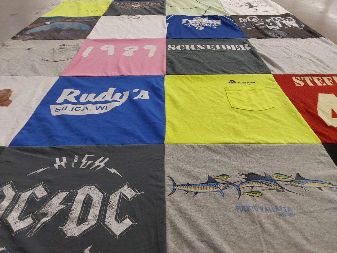 T-shirt quilt with music, fishing themes by Beth from WI