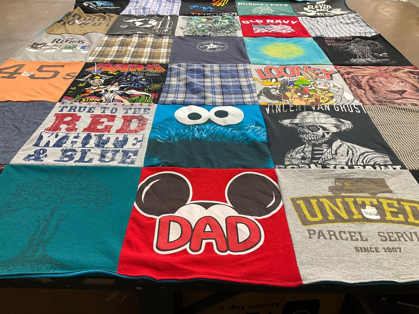 T-shirt quilt with cartoons, art themes by Susan from TX