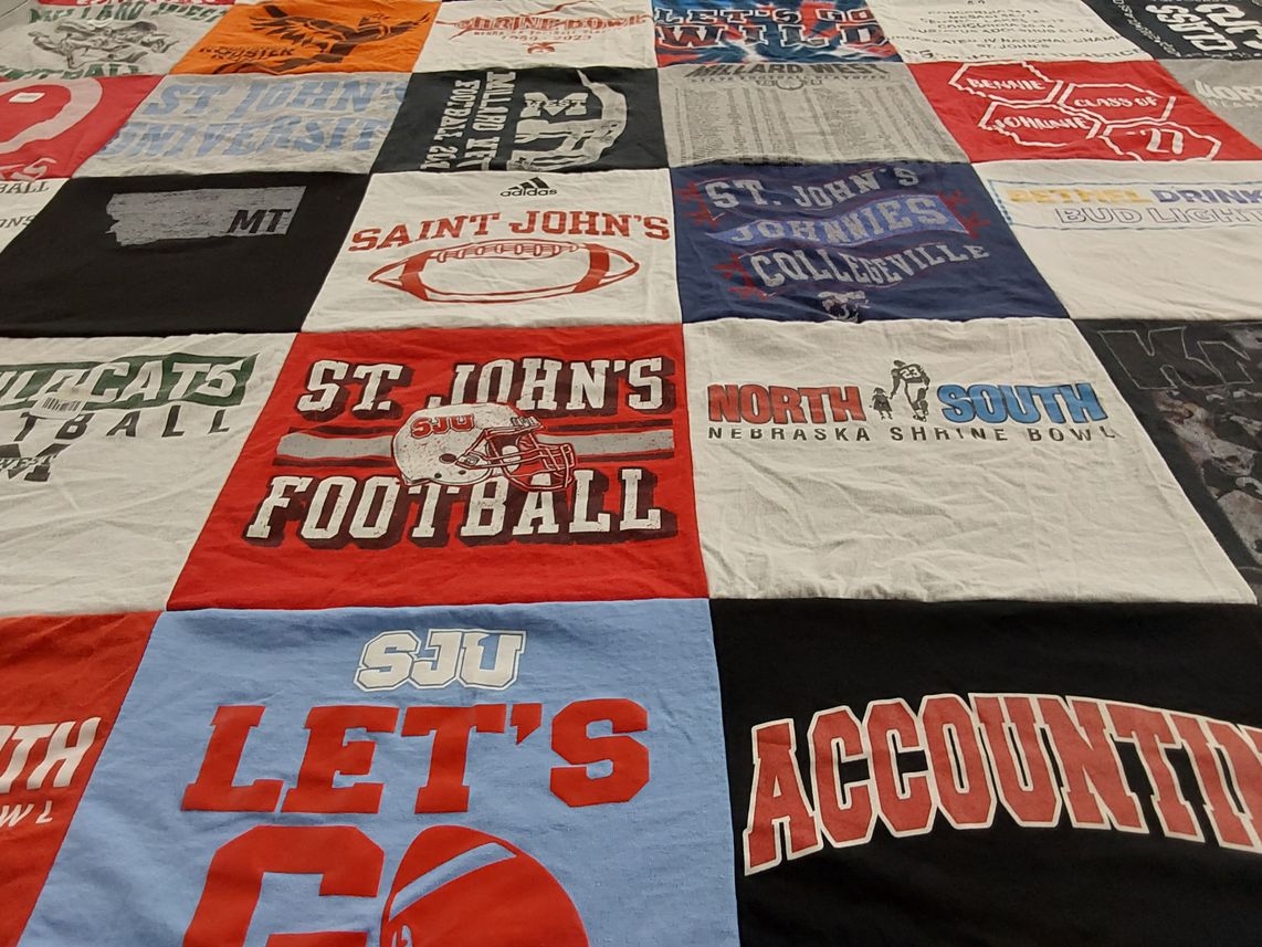 T-shirt quilt featuring st. john's football, north south football by Jona from NE