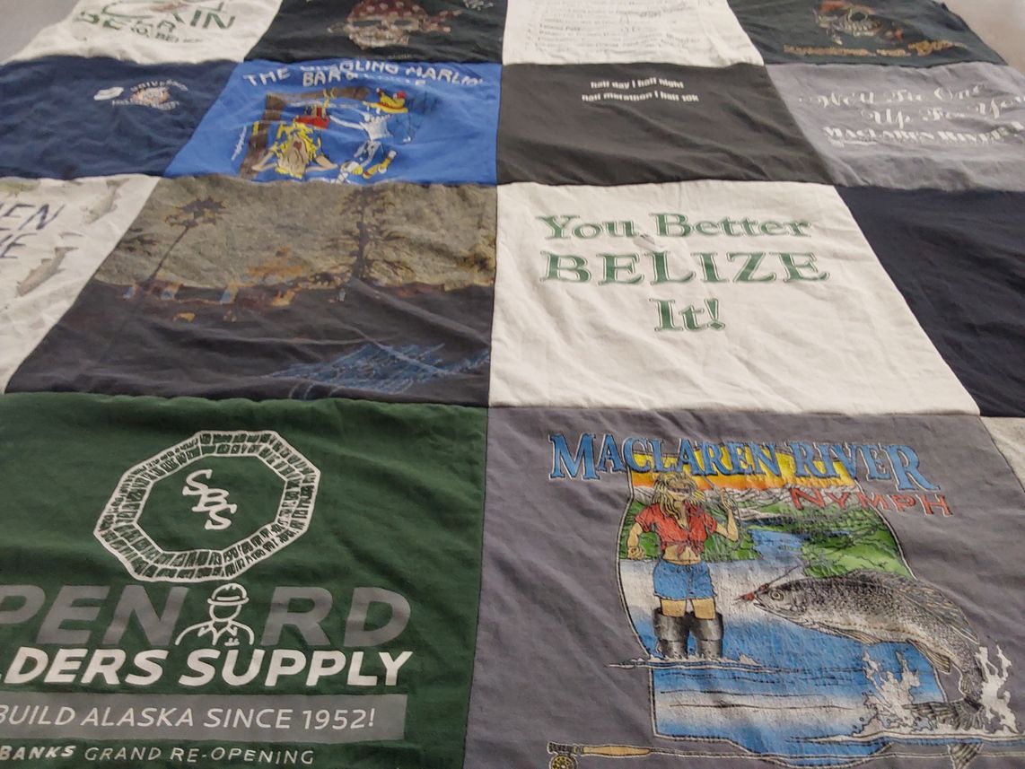 T-shirt quilt with fishing, travel themes by Joy from AK