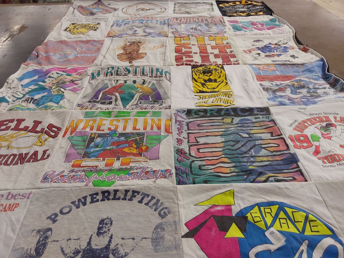 T-shirt quilt with sports, fitness themes by Sharon from CA