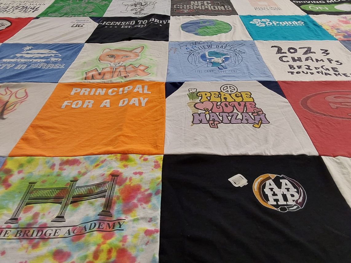 T-shirt quilt with bridge tournaments, camps themes by Karen from NJ