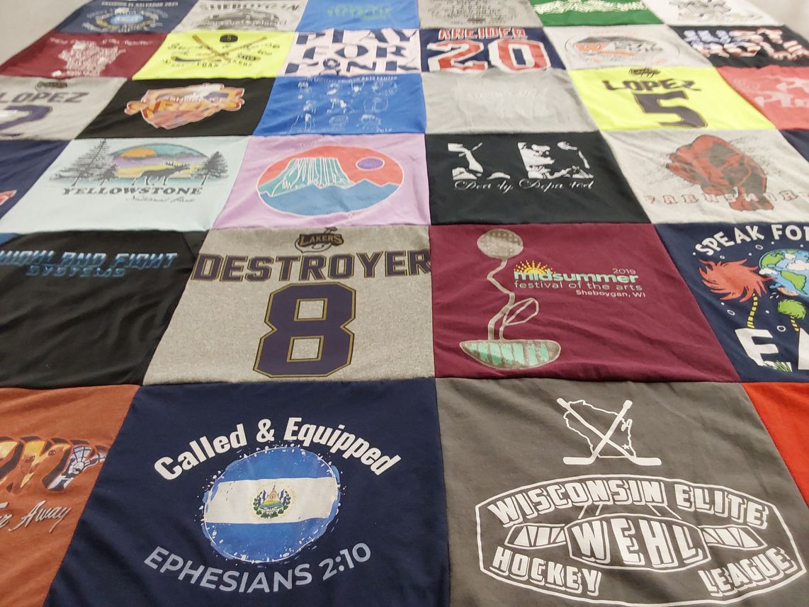 T-shirt quilt with hockey, arts themes by Justinne from WI