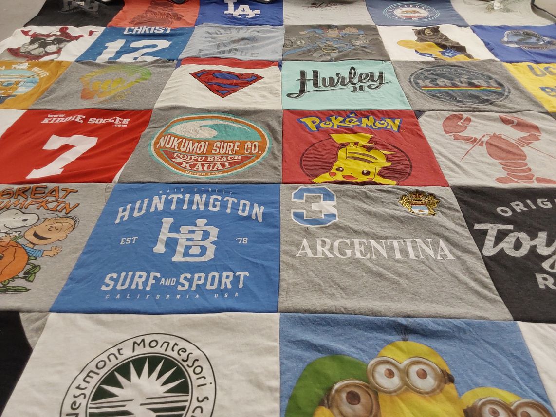 T-shirt quilt with surfing, hunting themes by David from TX