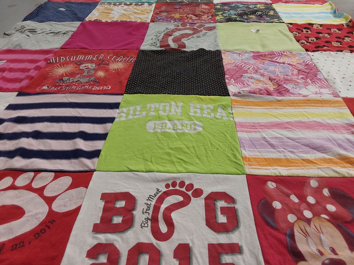 T-shirt quilt with vacation, sports themes by Cindy from VA