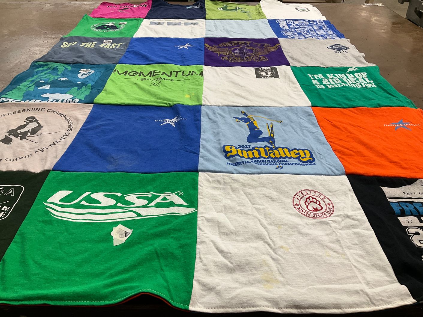 T-shirt quilt with skiing, snowboarding themes by Kaia from MA