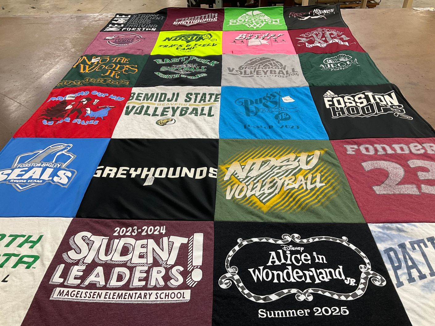 T-shirt quilt featuring fosston seals swim team, greyhounds volleyball by Genevive from MN