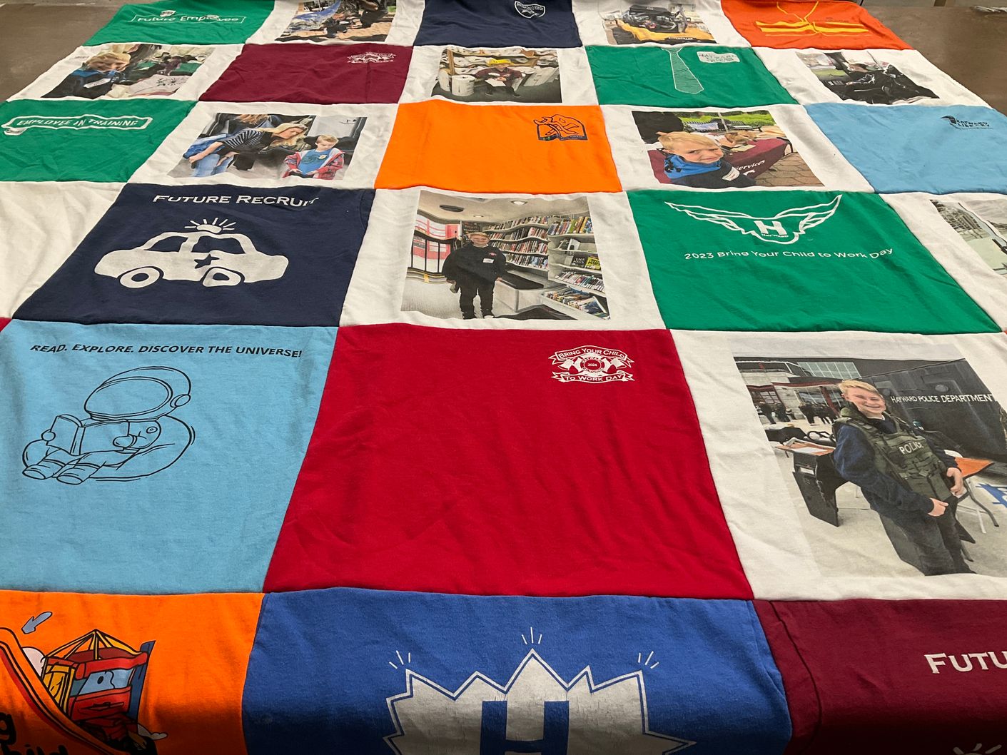 T-shirt quilt with education, careers themes by Tara from CA