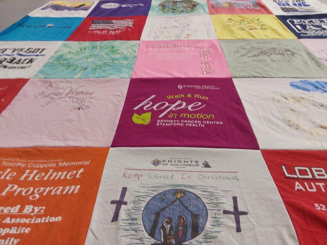 T-shirt quilt with health, community themes by Linda from CT