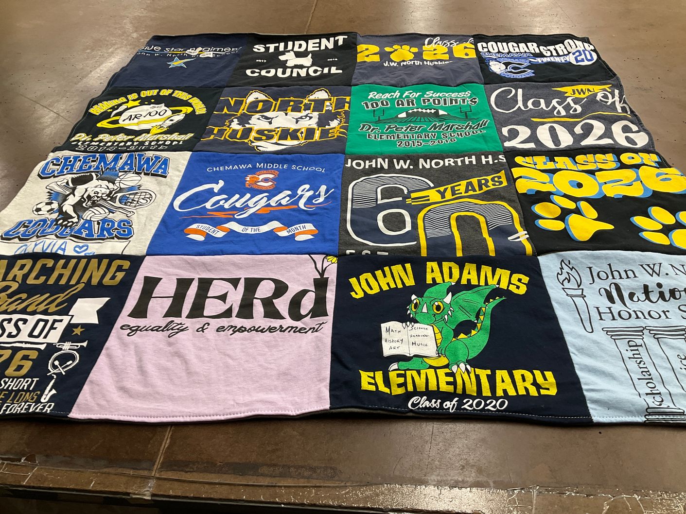 T-shirt quilt featuring north huskies, chemawa cougars by TET from CA