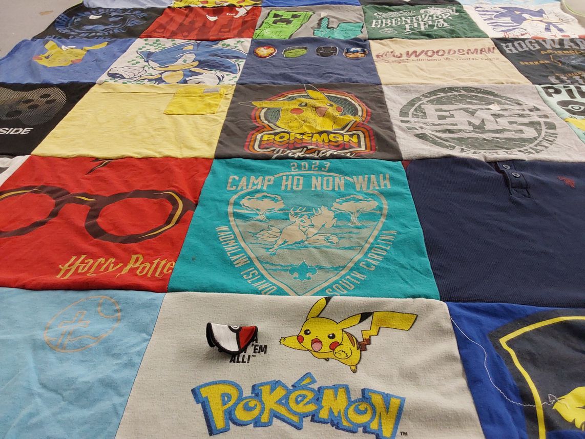 T-shirt quilt with pokemon, harry potter themes by Emily from GA