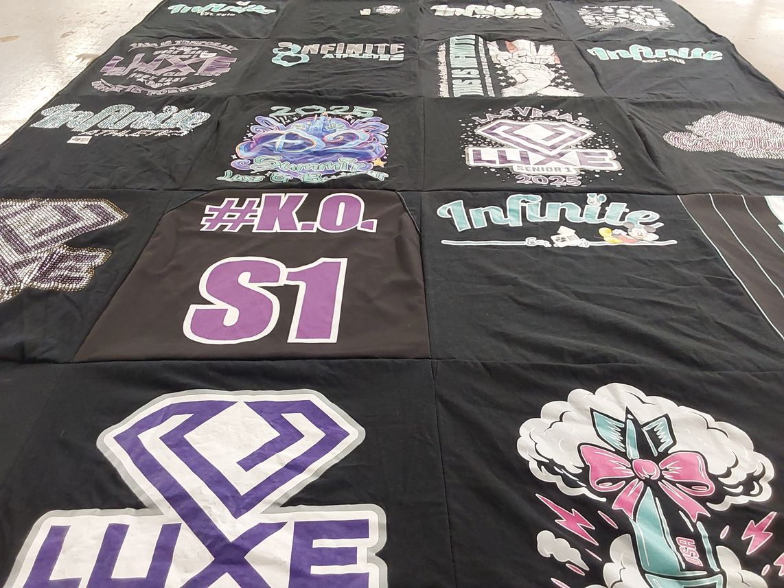 T-shirt quilt with cheerleading, dance themes by Susan from CA