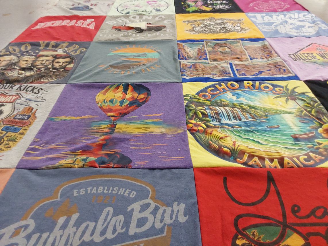 T-shirt quilt with travel, history themes by Debbie from IA