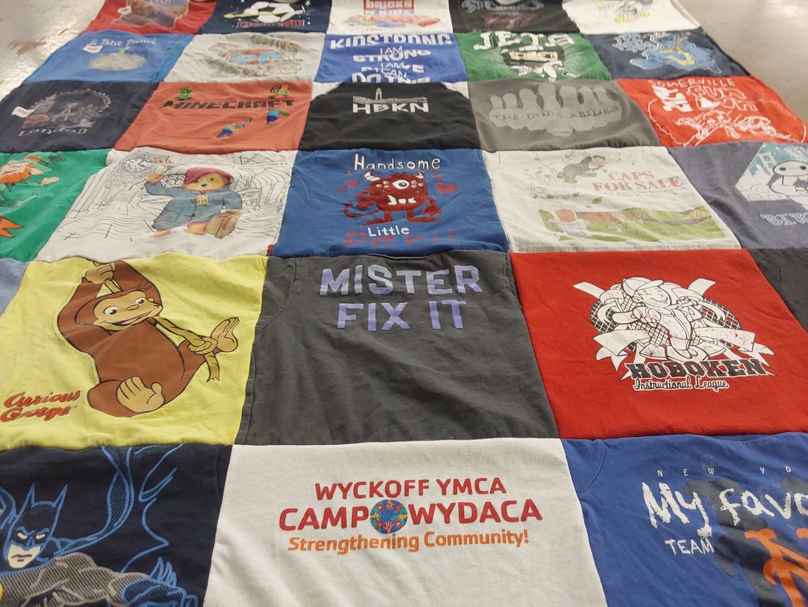 T-shirt quilt with cartoons, home improvement themes by Sophia M from NJ
