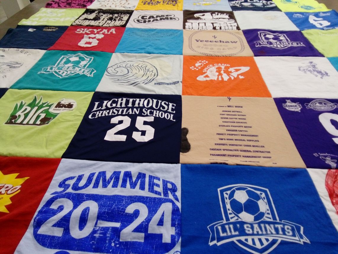 T-shirt quilt featuring lil saints by Marni from TX