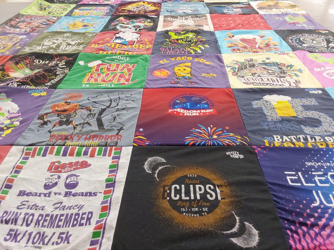 T-shirt quilt with running, events themes by Monica from TX