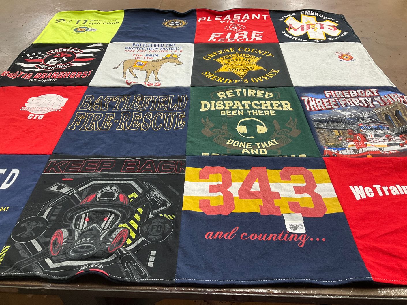 T-shirt quilt with firefighting, emergency services themes by John from MO