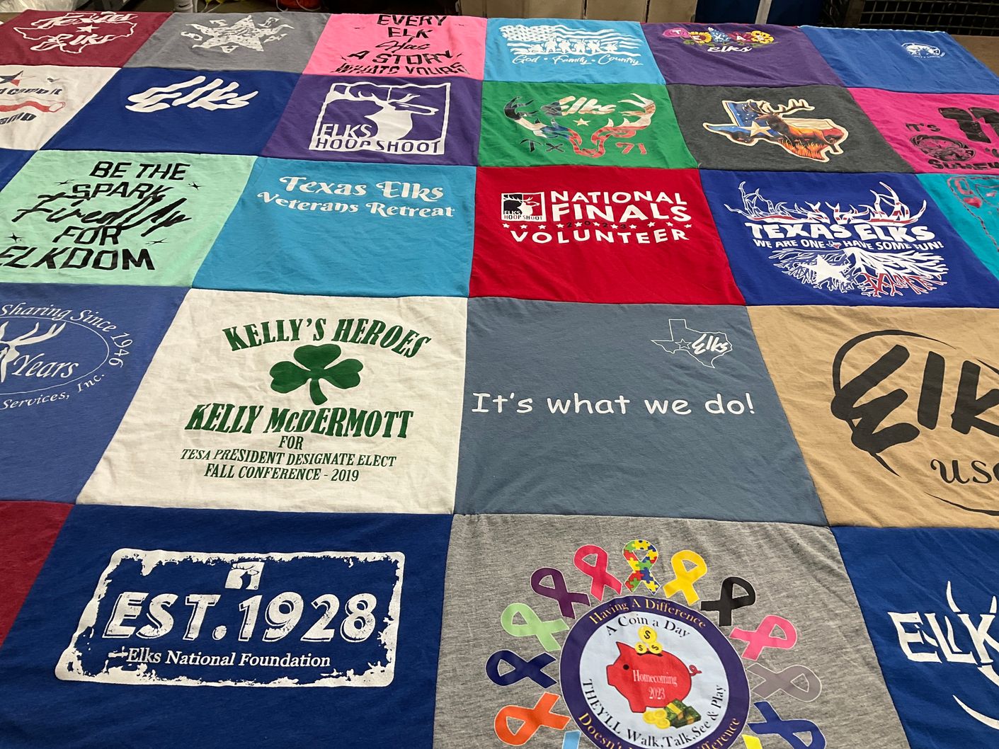 T-shirt quilt with community service, volunteering themes by Kimberly from TX