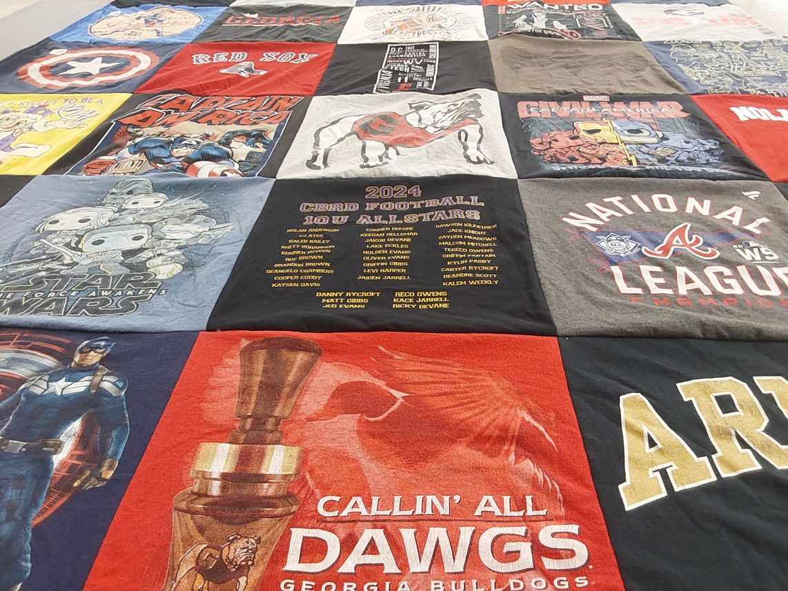 T-shirt quilt with superheroes, sports themes by Robert from GA