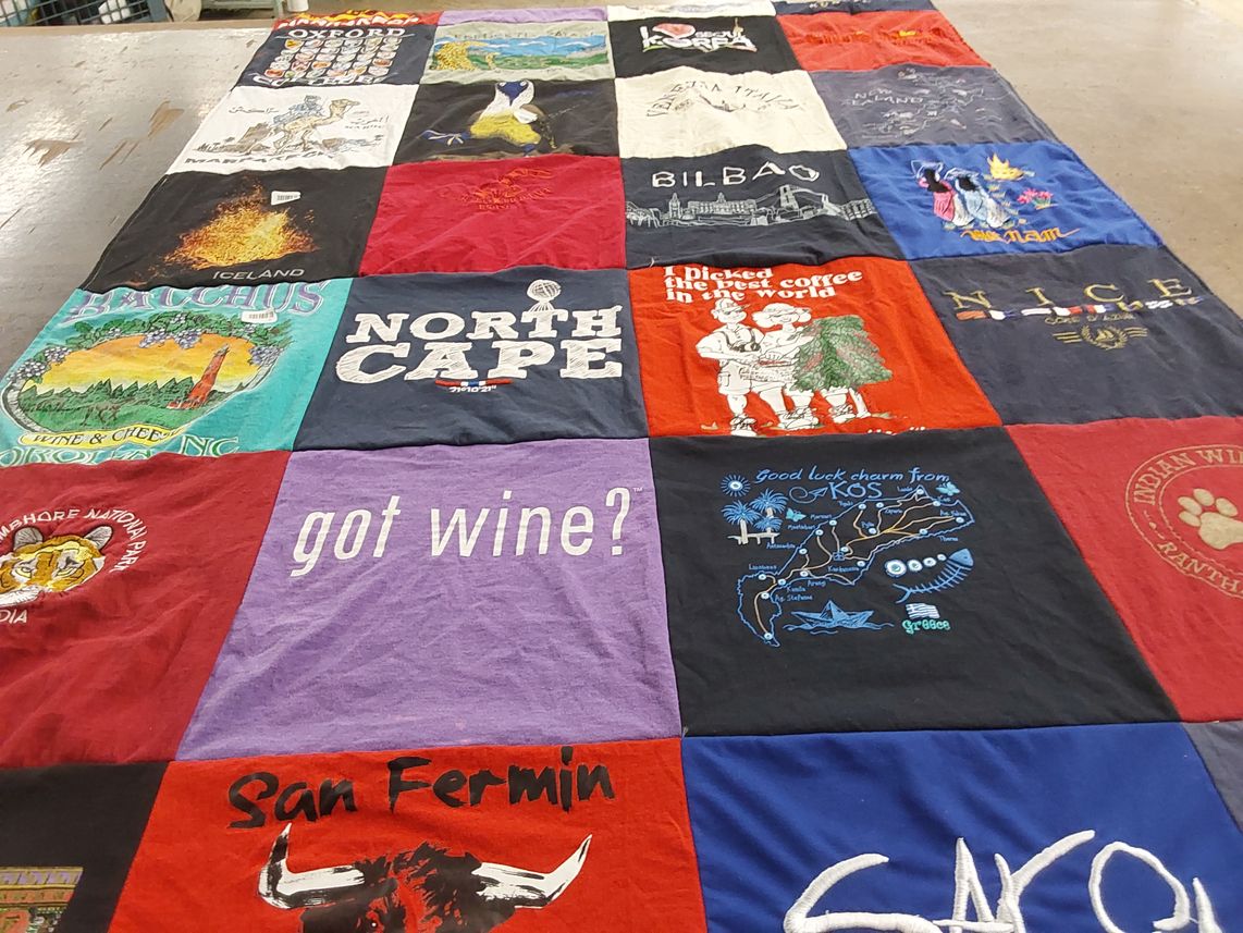 T-shirt quilt with wine, travel themes by Carolyn from FL