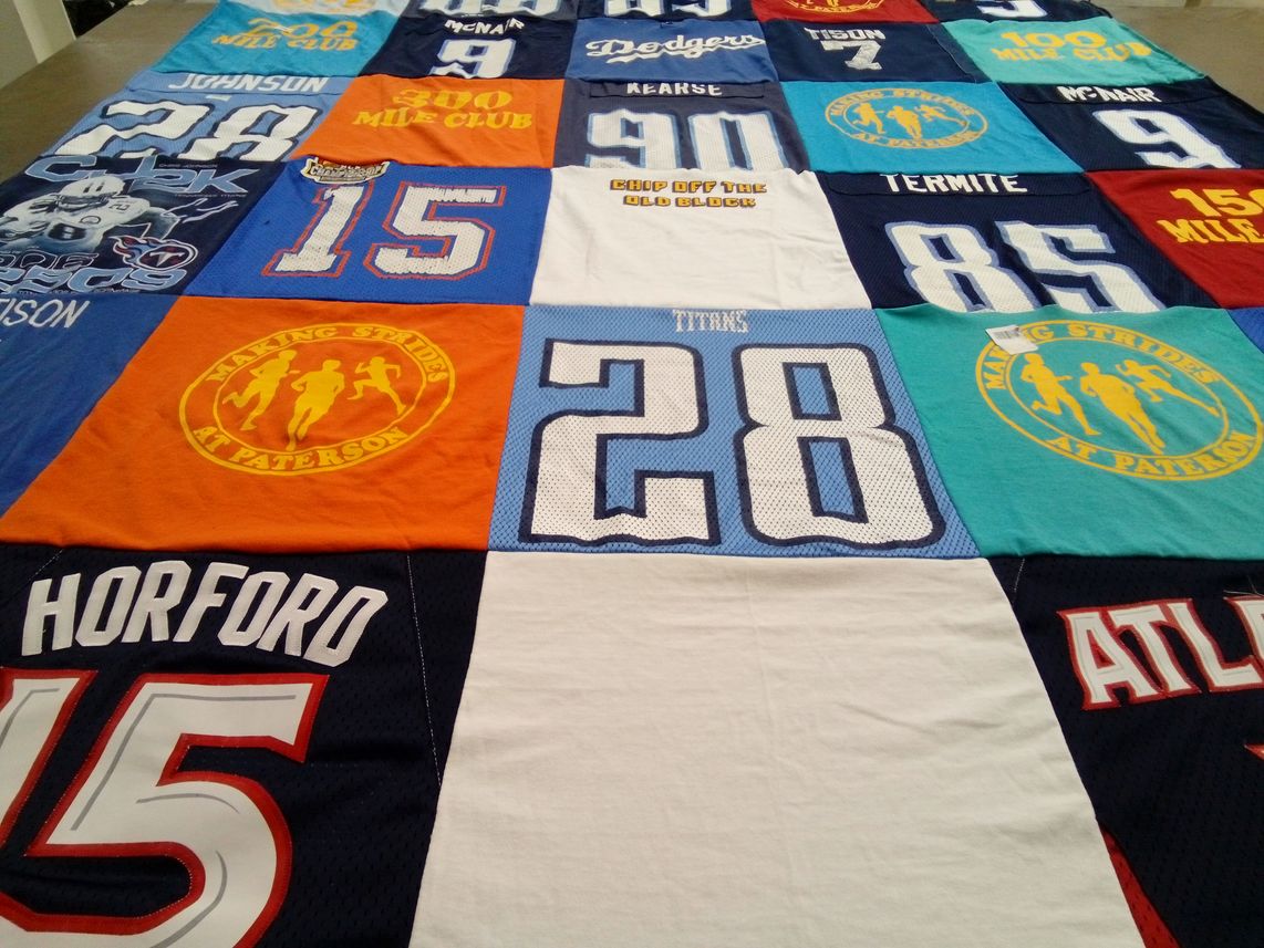 T-shirt quilt with sports, running themes by Cathy from FL