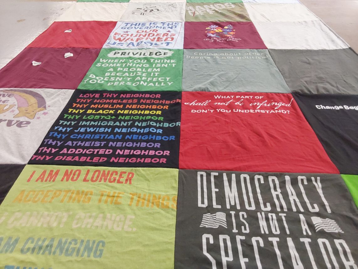 T-shirt quilt with social justice, community themes by stacey from NY