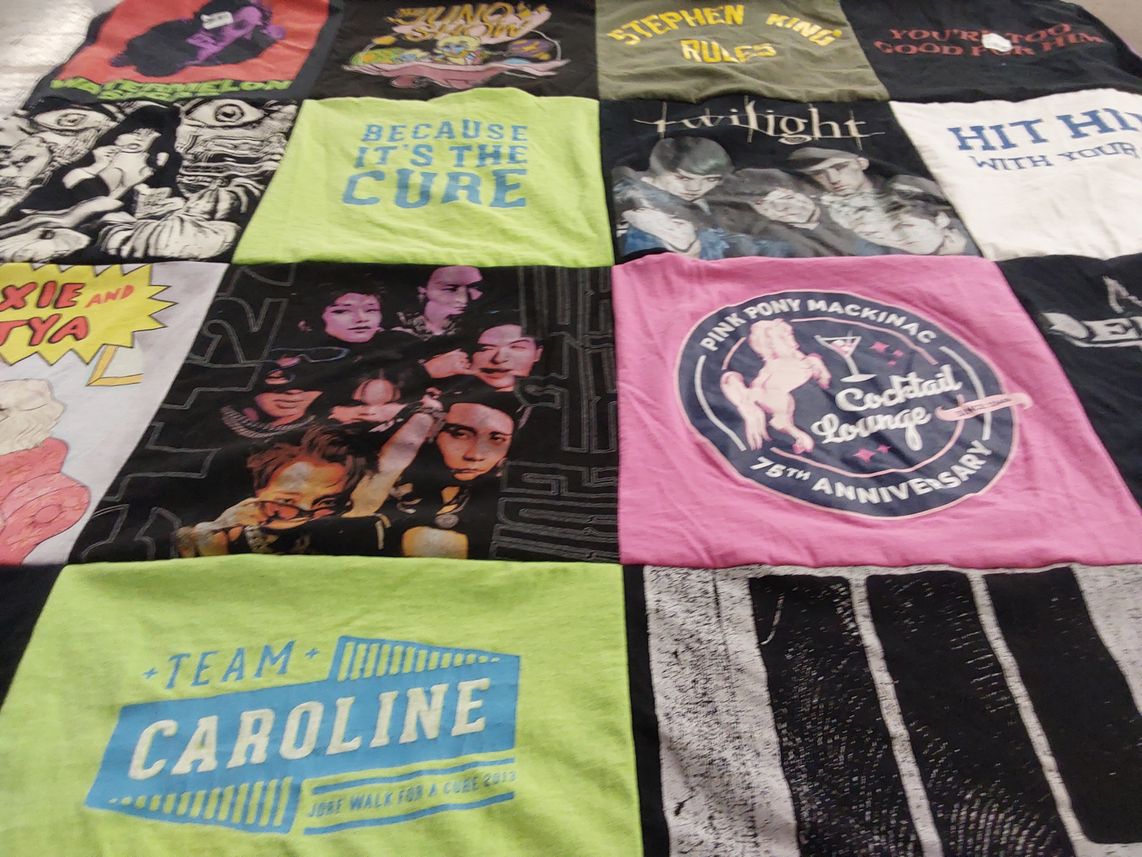 T-shirt quilt with books, movies themes by Penny from IL