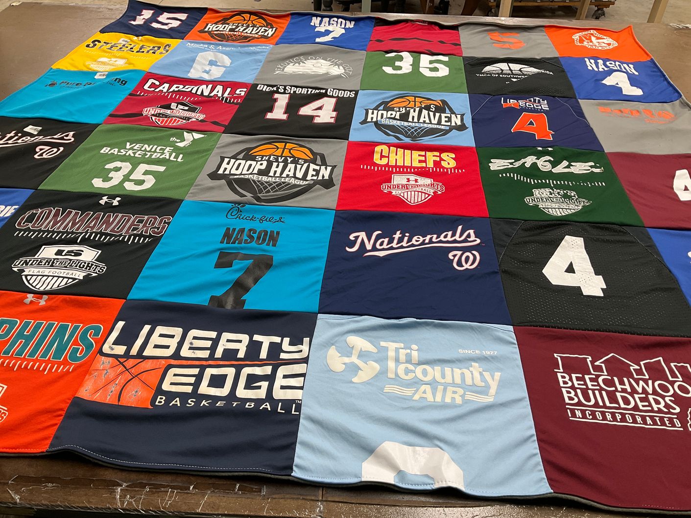 T-shirt quilt with basketball, football themes by Liz from FL