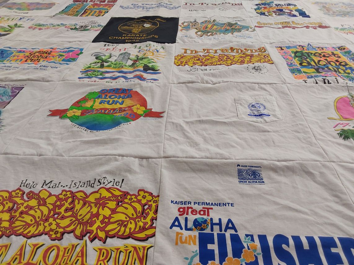 T-shirt quilt with running, sports themes by Betty from NM