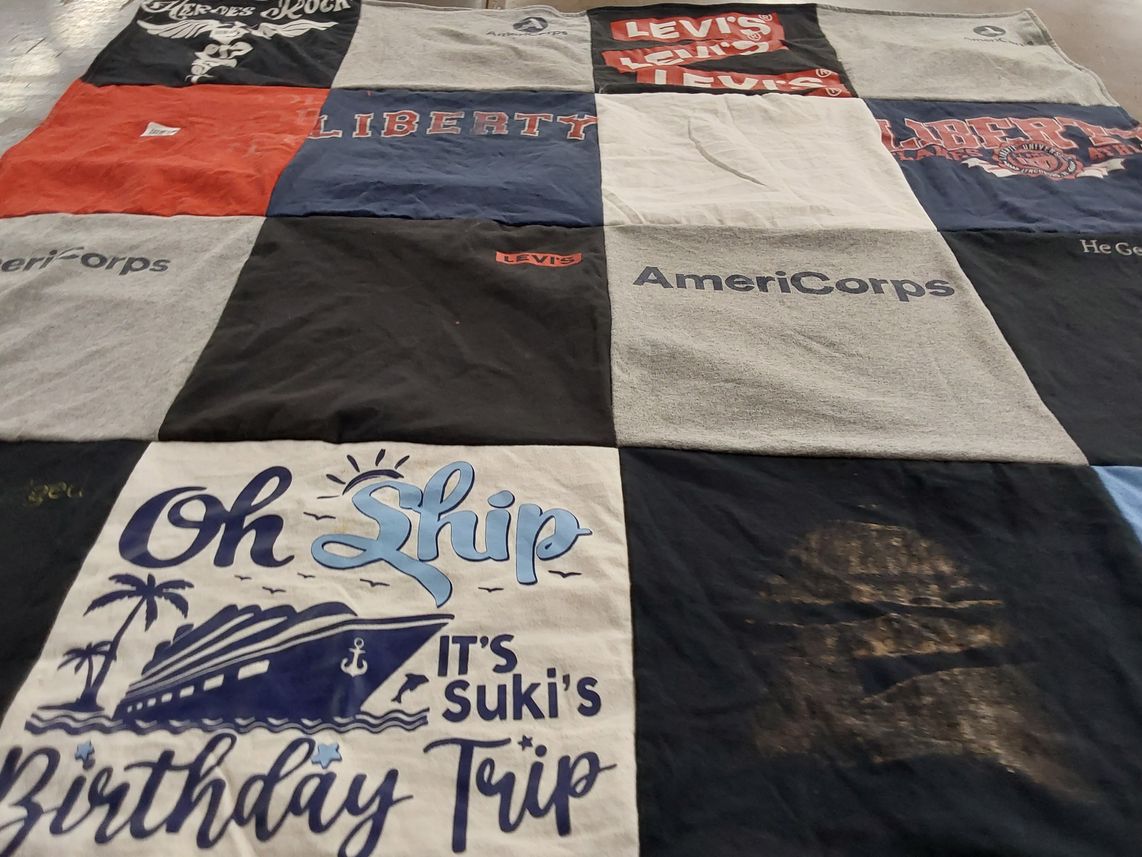 T-shirt quilt with travel, celebration themes by Janelle Christine from NY