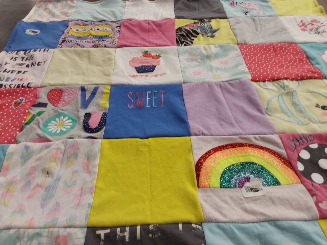 T-shirt quilt with positive messages, rainbows themes by Janice from OH