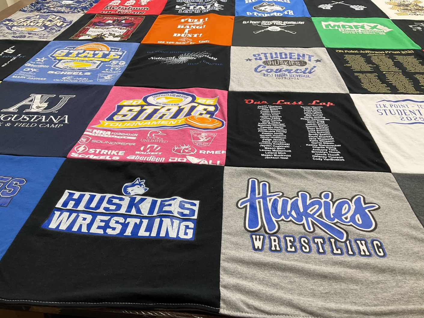 T-shirt quilt featuring huskies wrestling by Heather from SD