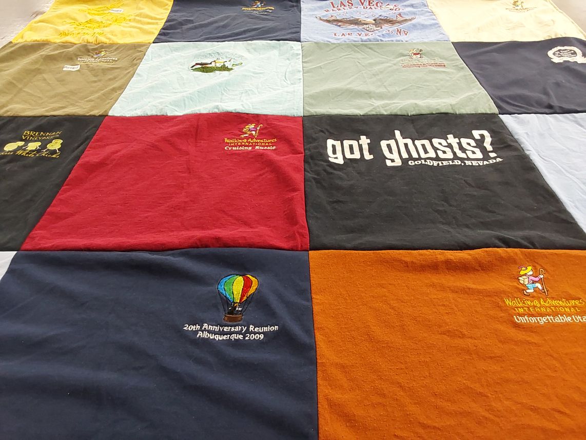 T-shirt quilt with travel, ghost hunting themes by April from NV