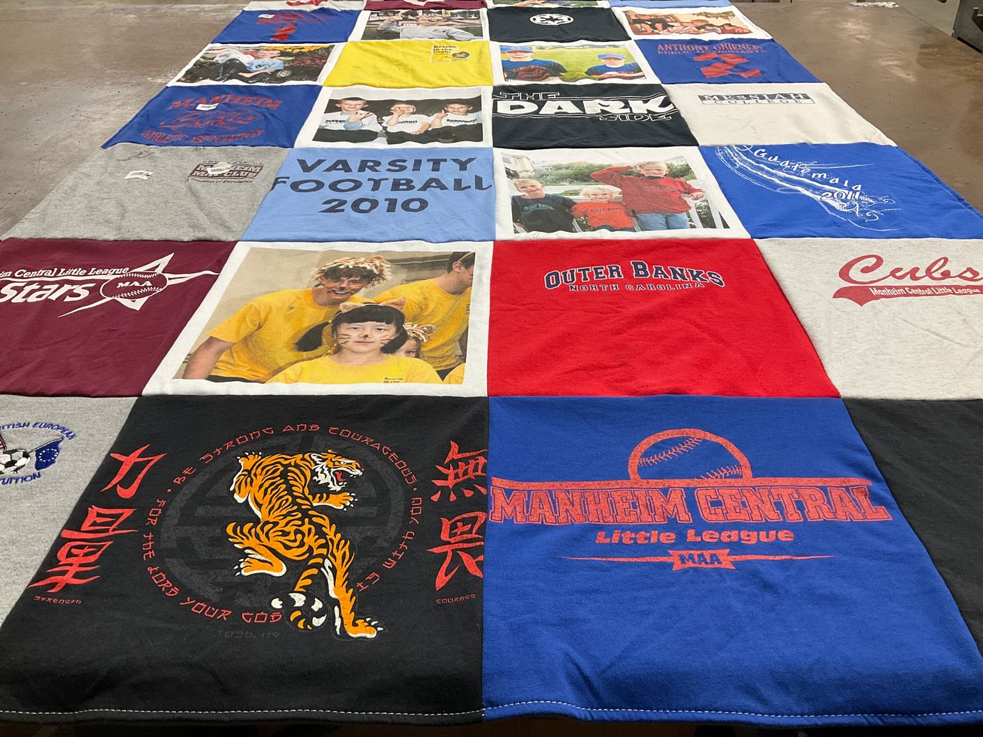 T-shirt quilt with sports, youth themes by Lynnea from PA