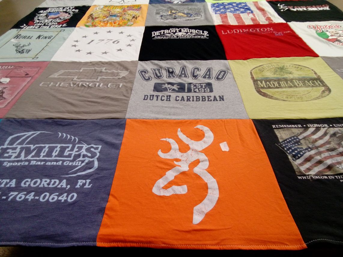 T-shirt quilt with sports, travel themes by Leslie from MI