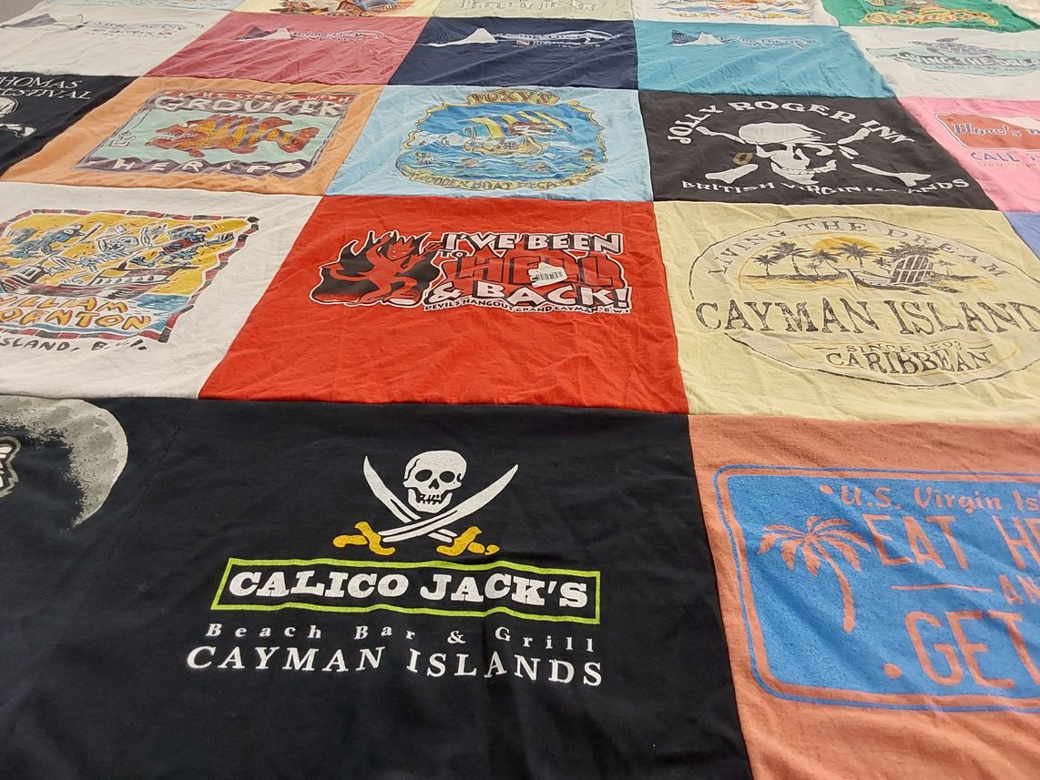 T-shirt quilt with travel, beaches themes by Ann from WI