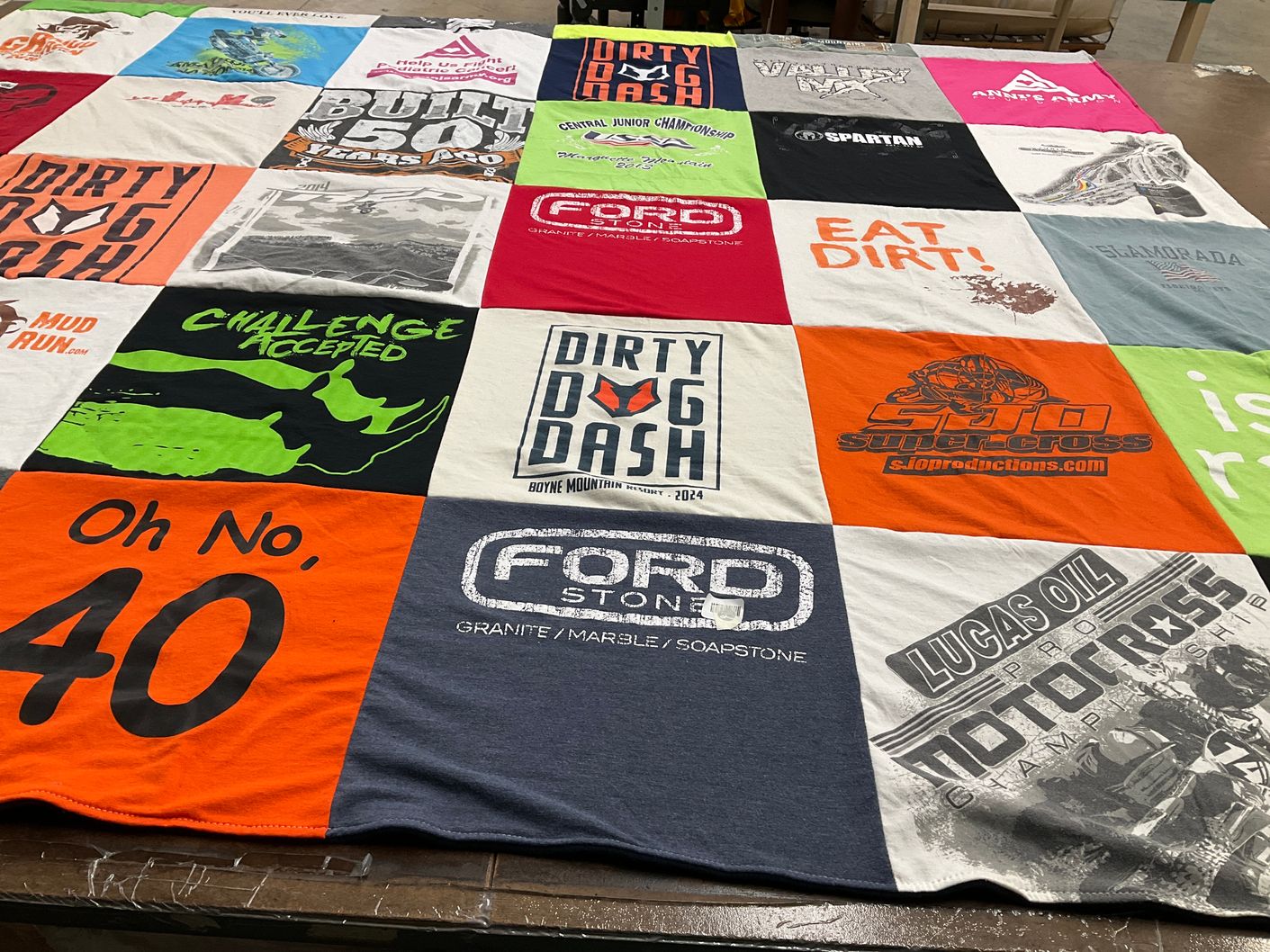 T-shirt quilt with motorsports, obstacle racing themes by Kat from MI