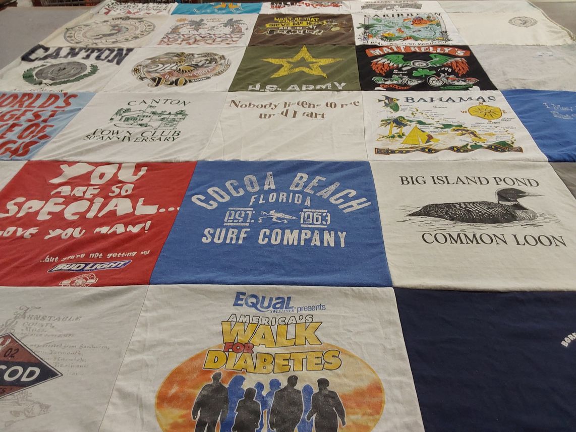 T-shirt quilt with travel, fitness themes by Diane E from MA